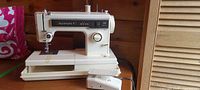 Kenmore Model 125 sewing machine on table with foot pedal attached