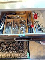 drawer view showing flatware, knives, utensils