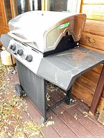 Full view of propane gas grill on deck