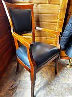 Full view of oak armchair showing frame, arms, seat, and back