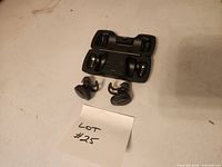 Earbuds in front of open charging case