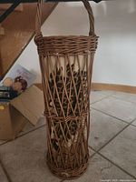 Full view tall wicker basket with handle, giraffe fabric insert