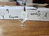 Two Exquisite branded boxes with one crystal martini glass displayed