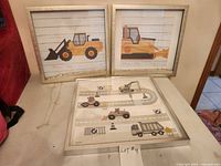 All three framed prints grouped together on a table