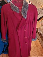 Red wool coat with grey faux-fur collar and cuffs, front view