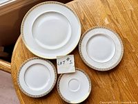 Four plates of different sizes showing front design and trim