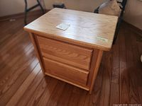 Front and top view of solid oak nightstand showing overall form and finish