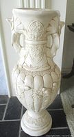 Full view of tall embossed chalkware vase