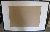 Full view of the IKEA black frame with mat and backing