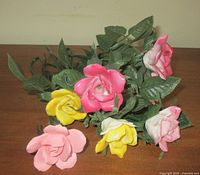 Cluster of bone china roses showing colors and leaves