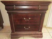 Front view of mahogany wash stand showing all drawers and base