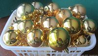 Basket filled with gold glass ornaments