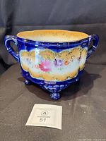 Front view of cobalt blue Nippon porcelain ferner planter on three feet