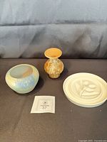 Three pottery pieces grouped