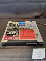 Roland SP-555 front angle showing pads, knobs and power cord