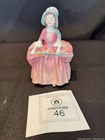 Front view of Royal Doulton Bo Peep figurine with MaxSold tag