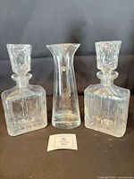 Front view of two decanters and vase
