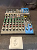 Full top view of Yamaha MG10XU showing all knobs, inputs and faders