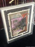 Angled view displaying clear acrylic shadow-box frame