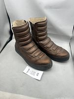 Boots side view showing padded design and overall condition