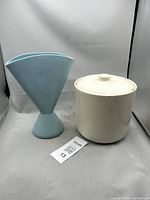 Vase and canister side by side