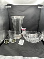 Full lot showing vase, bowl, two cocktail glasses for scale with soda can
