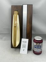 Knife handle mounted on exterior of closed case with reference object