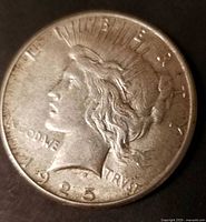 Obverse of 1925 Morgan silver dollar showing Liberty head, date visible