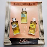 Front view of display box with three Lentheric bottles in place