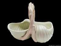 Side view showing double shell bowls and coral handle