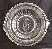 Top view of pressed glass cake plate showing full pattern and handles