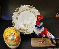 Front view of all three items: milk glass plate, papier-mâché egg, felt rooster