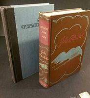 Front covers of both hardcover novels