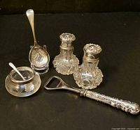 All six sterling silver table items grouped