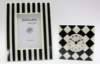 Front view of striped photo frame and diamond-pattern clock