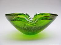 Side profile showing green glass encased in clear glass with gold flecks