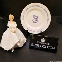 Front view of figurine, advertising plate and sign