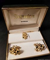 Open presentation box showing cufflinks and tie tack with Senator Sherman logo