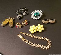 Group shot of all seven signed vintage costume jewellery pieces