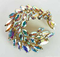 Front view of crescent brooch showing rhinestone arrangement