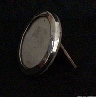 angled left side view displaying easel back and edge dent