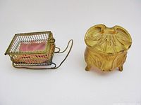 Wire sleigh box and gold tone casket front view