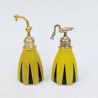 Front view of both yellow glass atomizer bottles