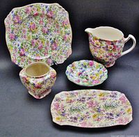 Group view of all five floral chintz china pieces