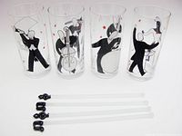 front view of four jazz motif highball glasses and four swizzle sticks