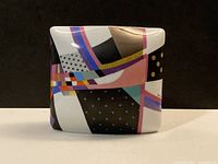 Front view of rectangular ceramic vase with geometric decoration