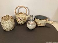 Group shot of all four signed studio pottery pieces