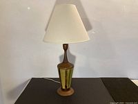 Full lamp with shade lit, showing overall design