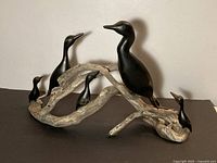 Overall view of driftwood base with five cedar cormorants