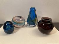 All four art glass vases grouped together